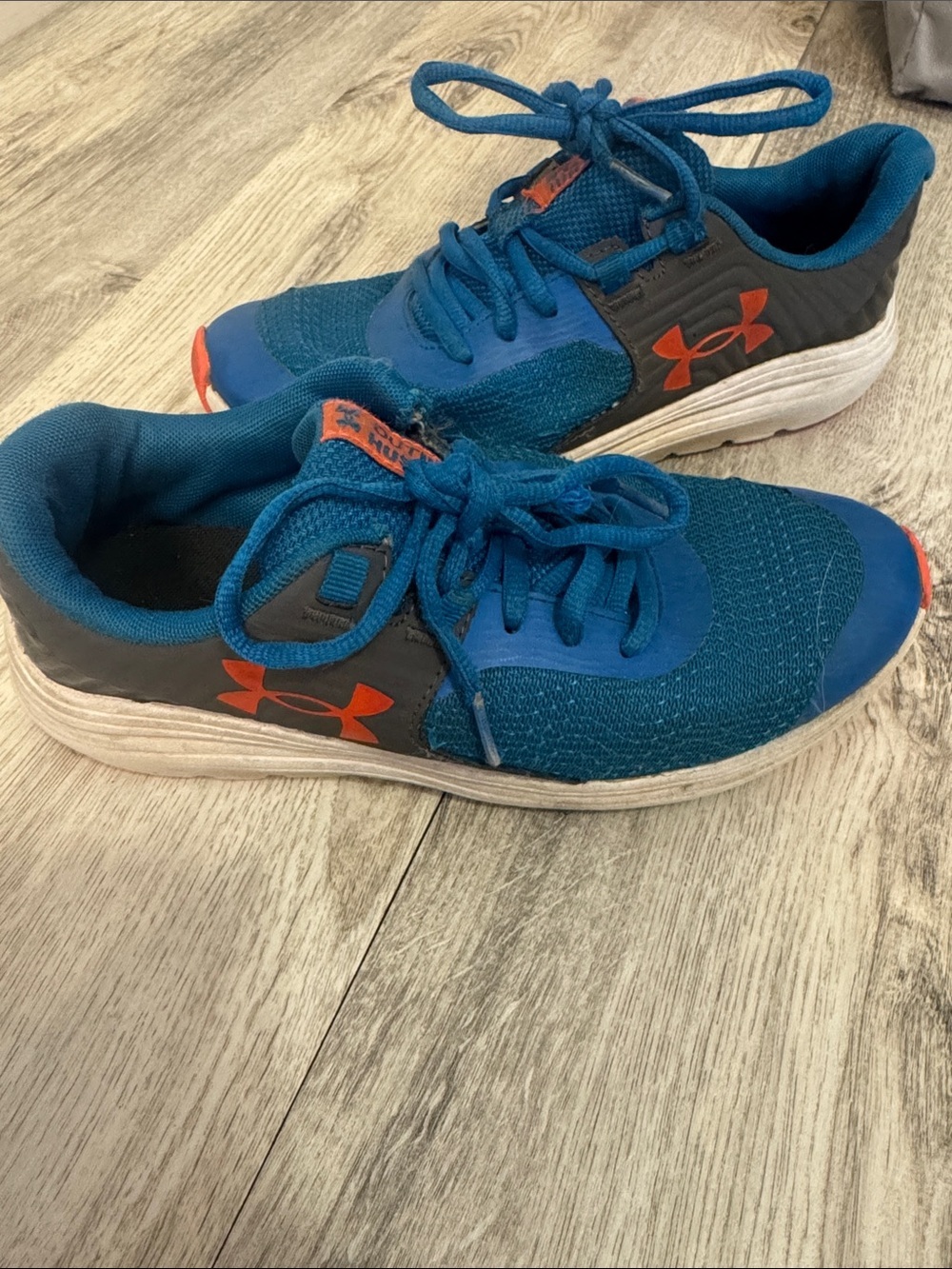 Under Armour Youth  Blue Sneakers with Orange Logo Accents